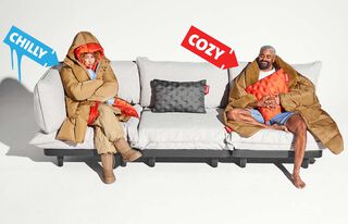 1 person wearing thick coat, the other a Hotspot Blanket